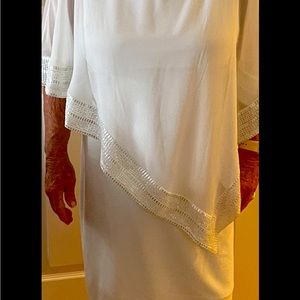 White dress with Silver trim.